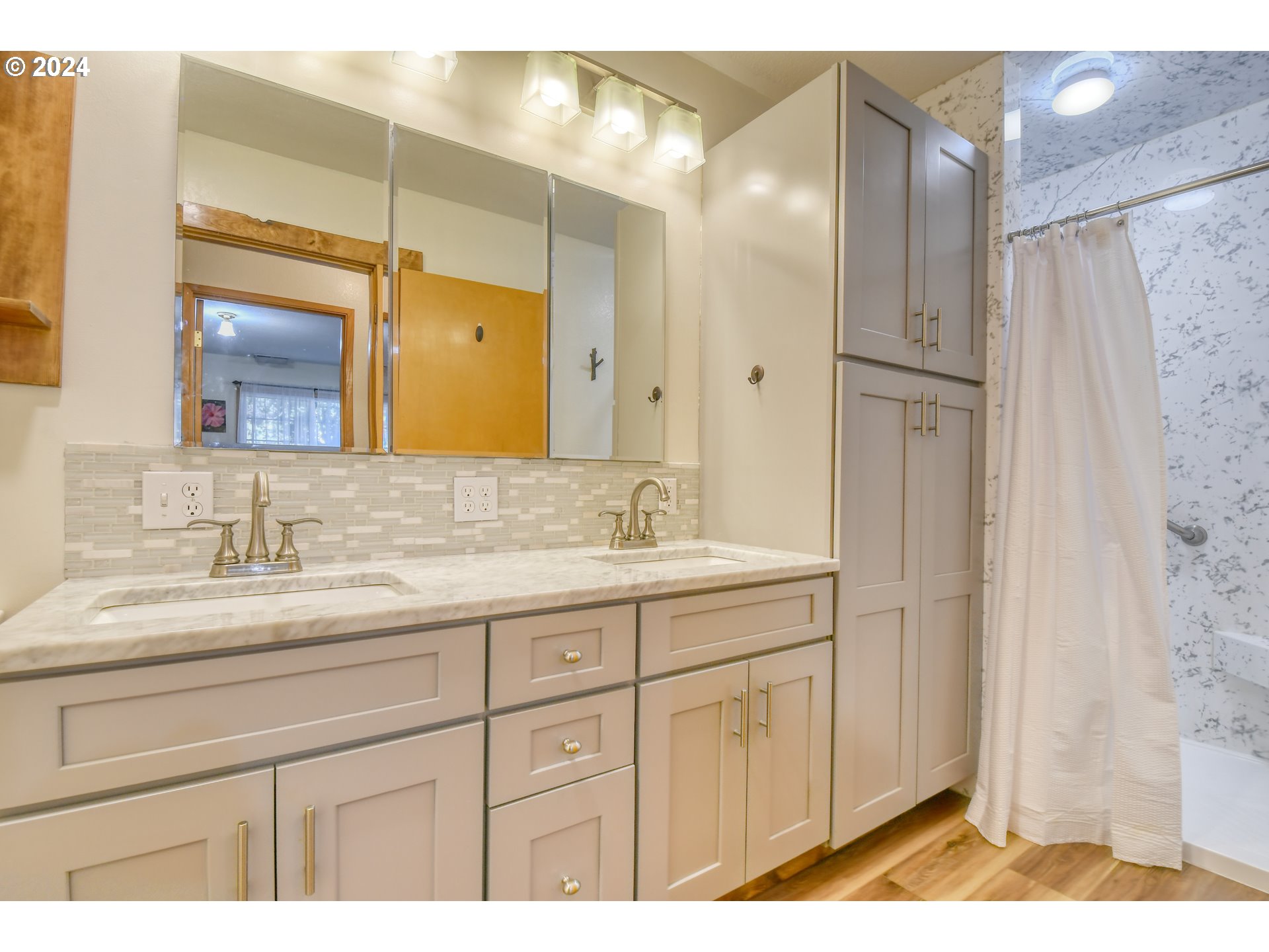 3010 Northeast Riverside Avenue Pendleton, OR 97801 - Photo 28 of 47 a bathroom with a granite countertop sink mirror and double