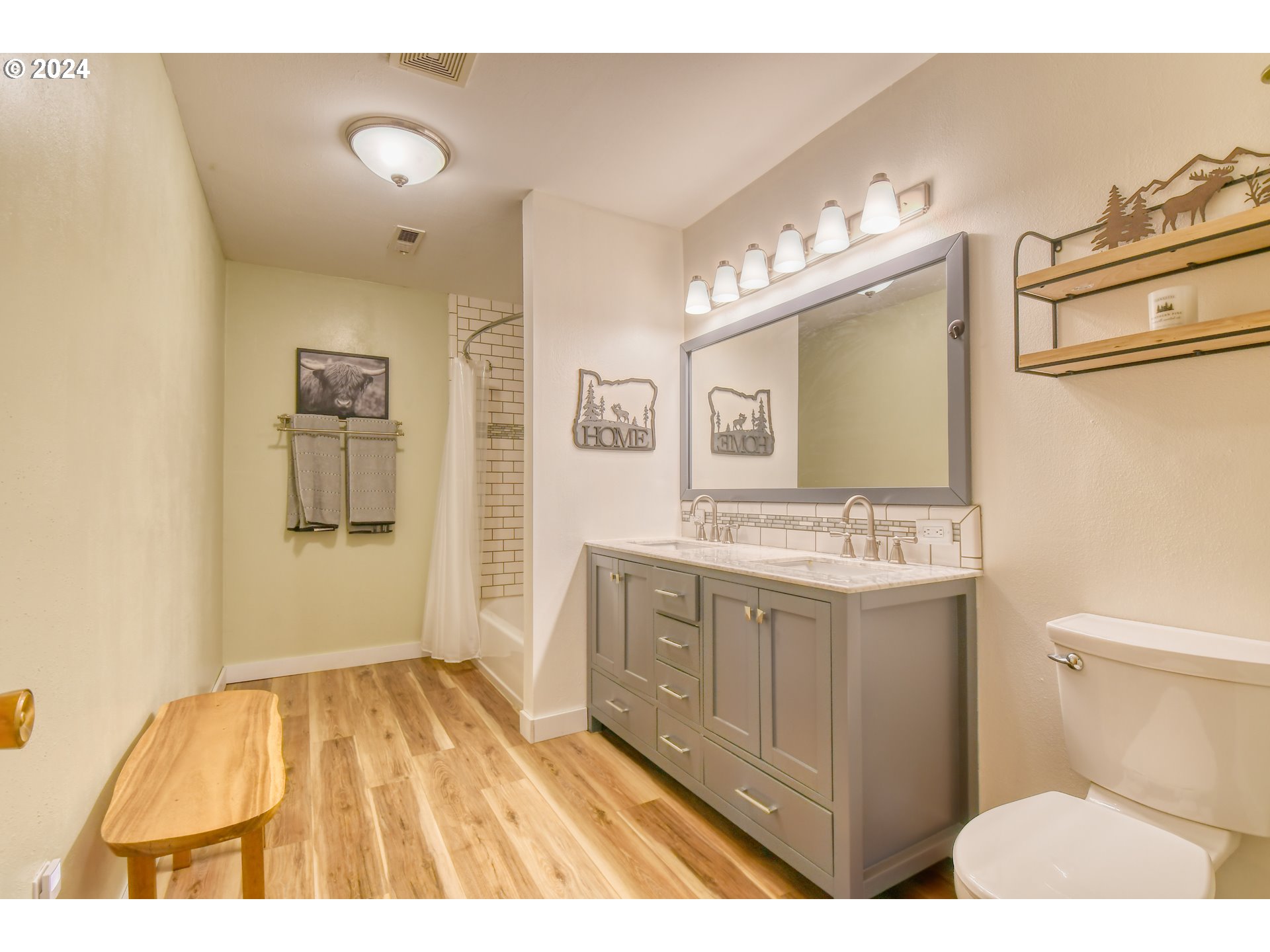 3010 Northeast Riverside Avenue Pendleton, OR 97801 - Photo 35 of 47 a bathroom with a sink a mirror and a toilet
