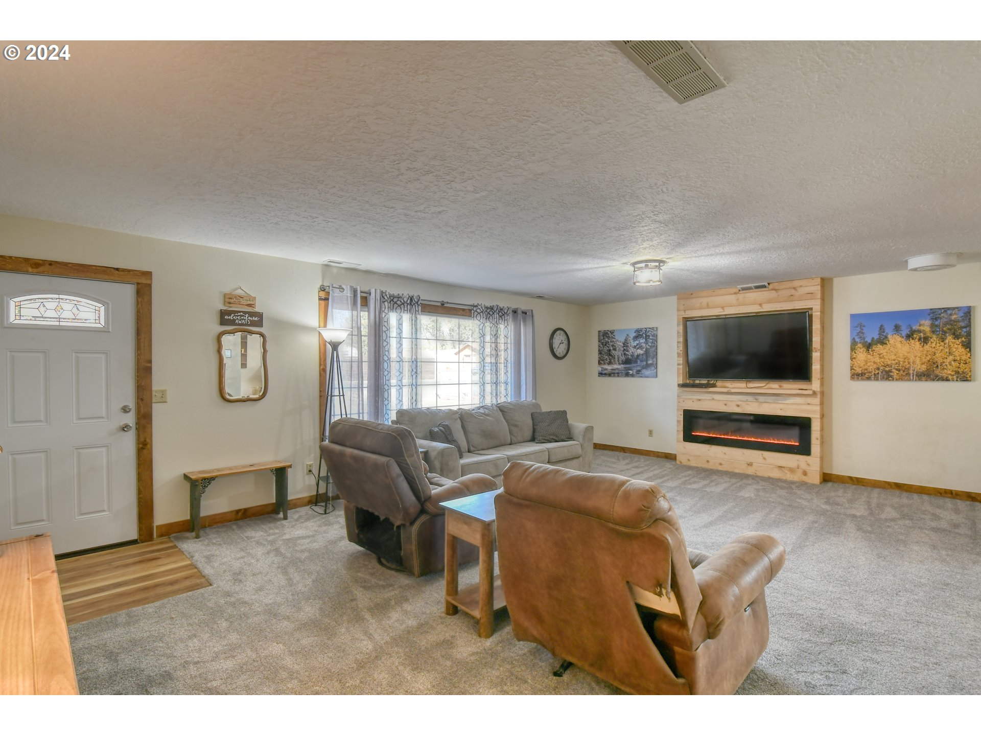 3010 Northeast Riverside Avenue Pendleton, OR 97801 - Photo 8 of 47 a living room with furniture and a flat screen tv