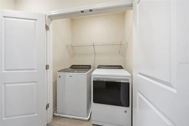 a utility room with dryer and washer