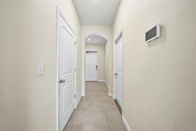 a view of a hallway with a wooden door