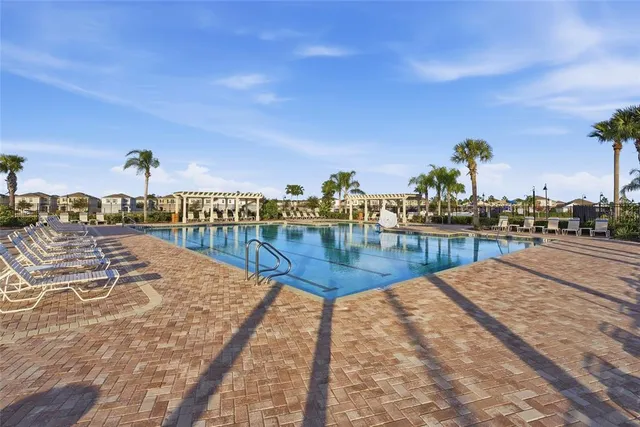a view of swimming pool with outdoor seating