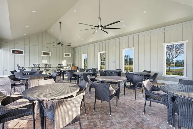 a living room with lots of furniture and a chandelier