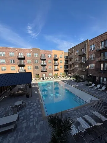 a view of a swimming pool with a lounge chair