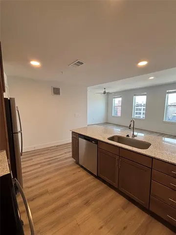 a spacious bathroom with a double vanity sink and a mirror
