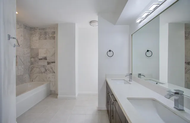 a bathroom with a bathtub and a sink