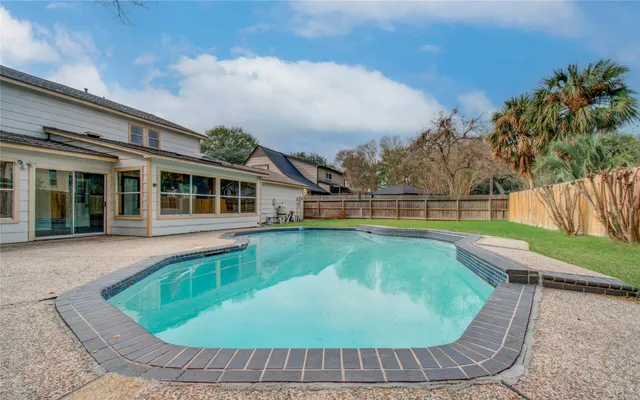 front view of a house with a swimming pool