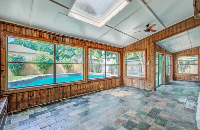 a view of an empty room with a large window