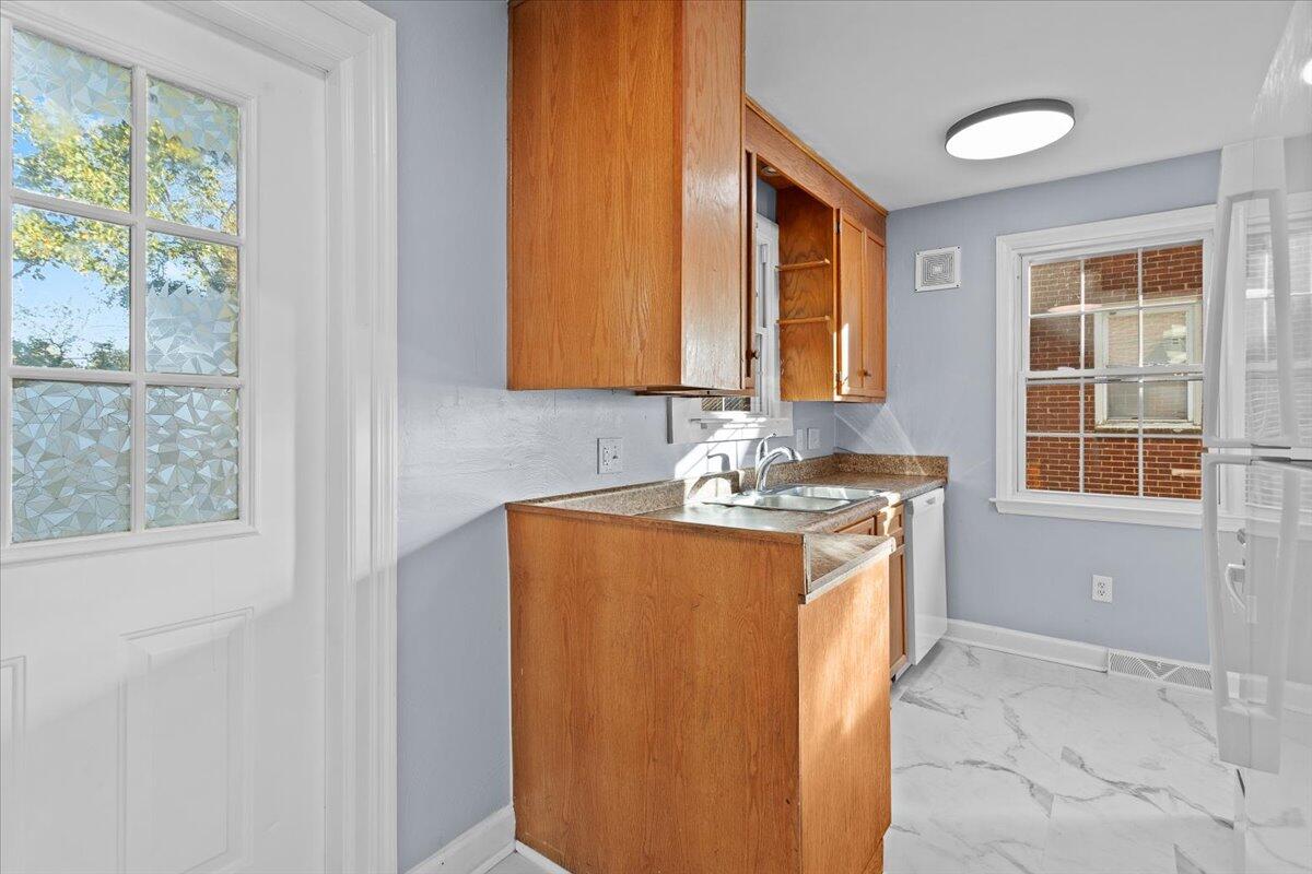 2617 Radford Road Northeast Roanoke, VA 24012 - Photo 12 of 25 a bathroom with a sink and a mirror