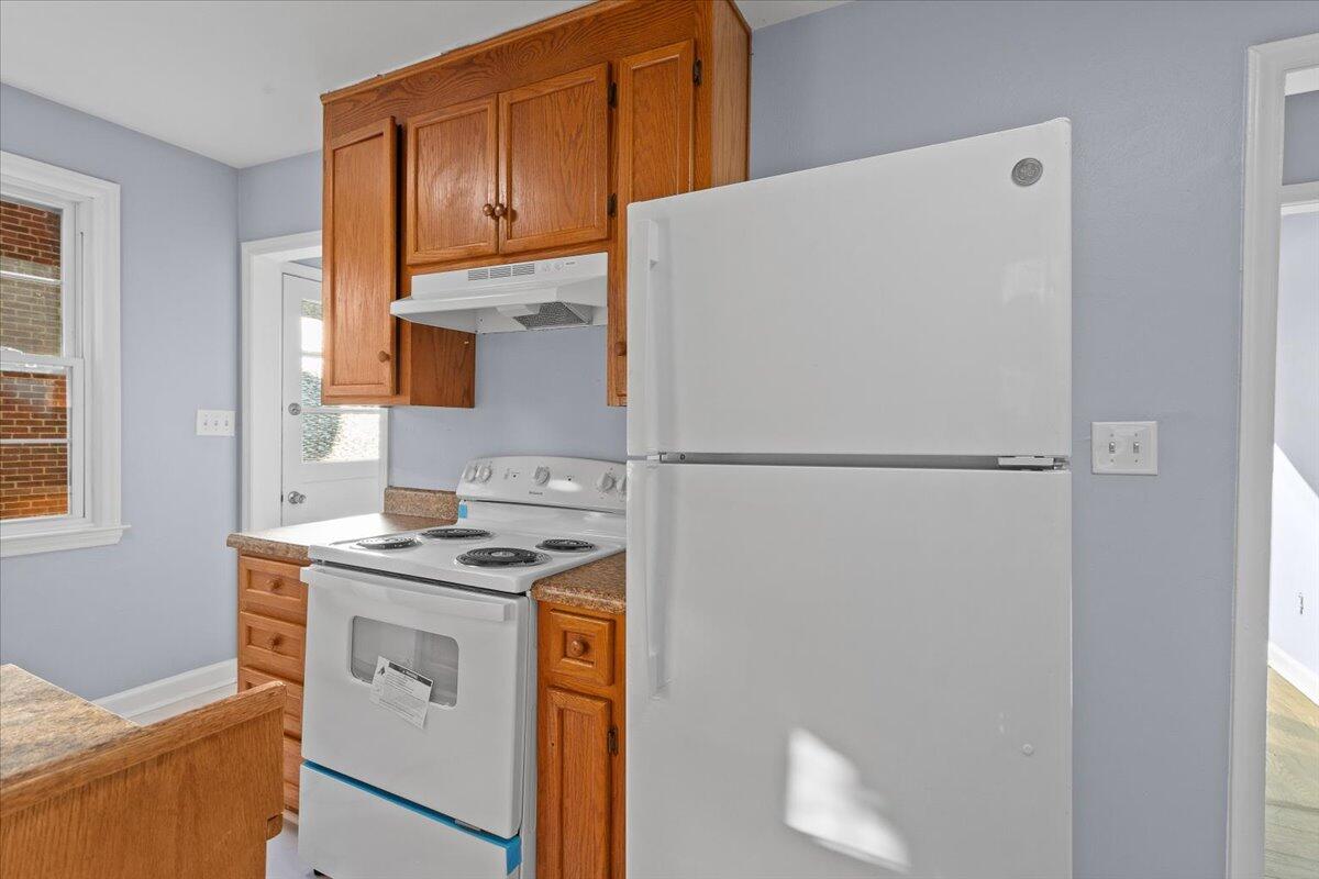 2617 Radford Road Northeast Roanoke, VA 24012 - Photo 13 of 25 a kitchen with a refrigerator sink and cabinets