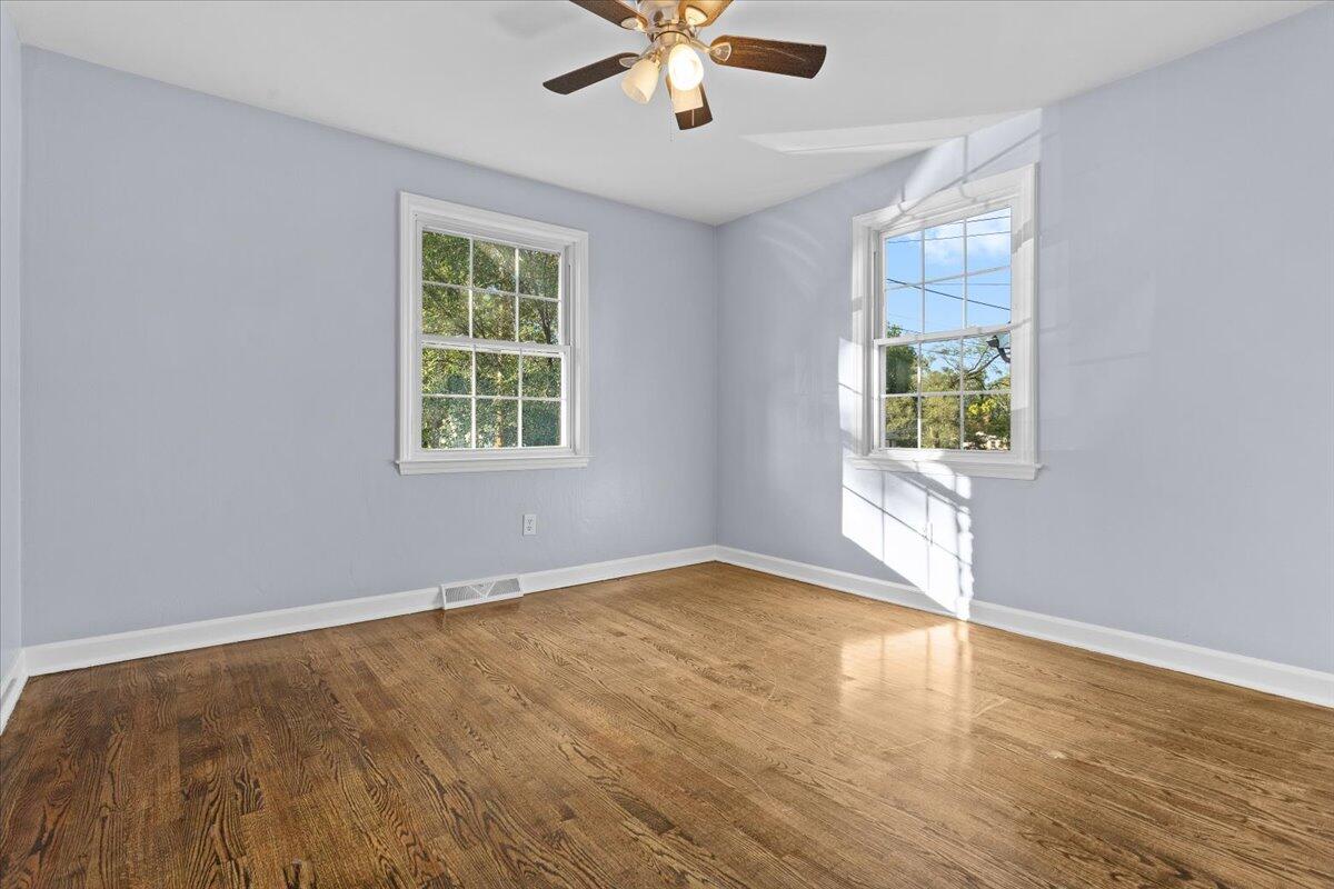 2617 Radford Road Northeast Roanoke, VA 24012 - Photo 16 of 25 wooden floor in an empty room with a window