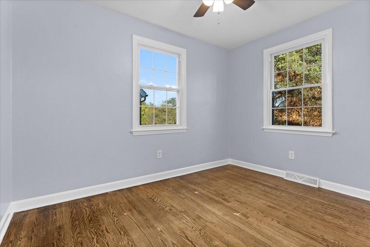 2617 Radford Road Northeast Roanoke, VA 24012 - Photo 18 of 25 wooden floor in an empty room with a window