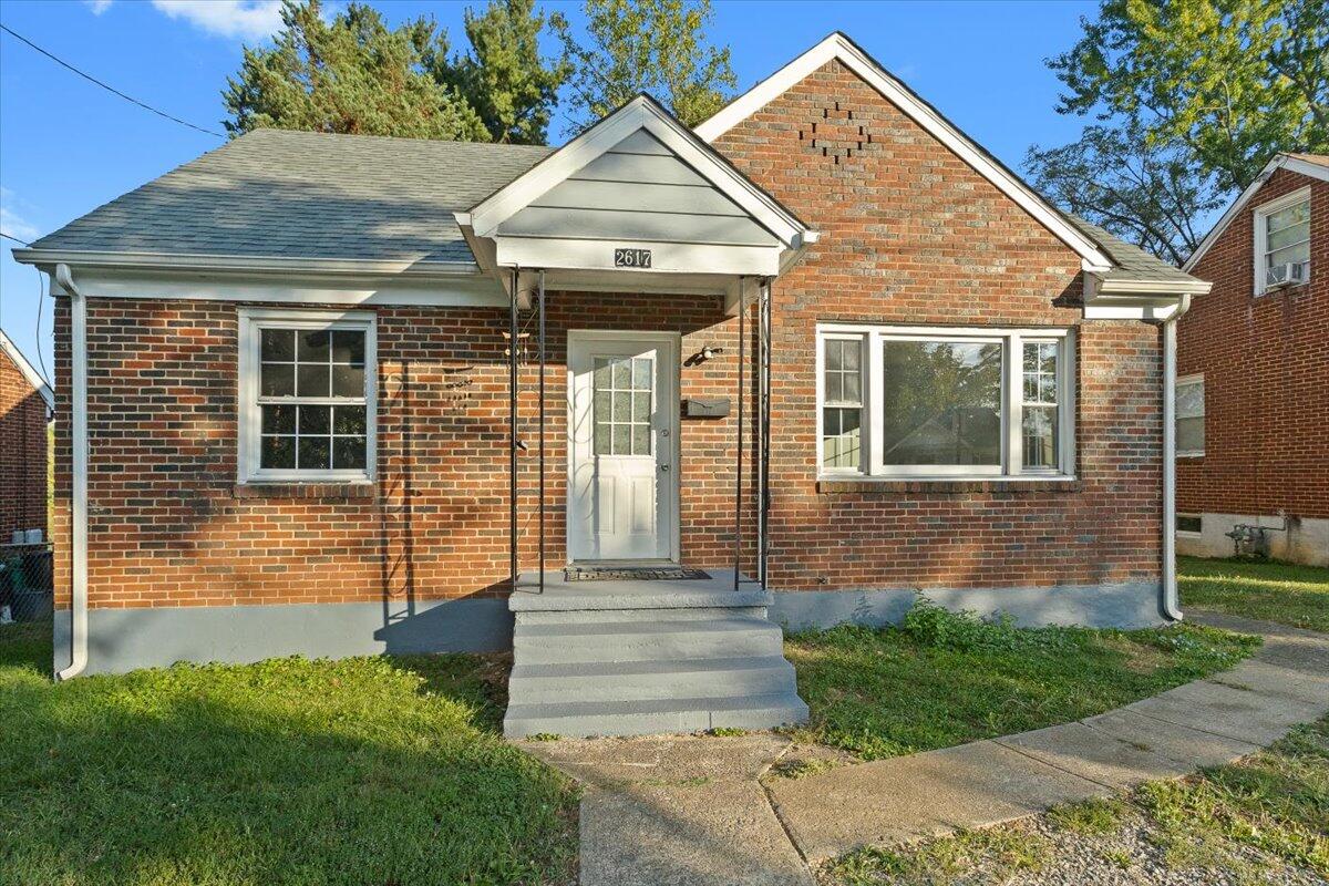 2617 Radford Road Northeast Roanoke, VA 24012 - Photo 2 of 25 a front view of a house with garden