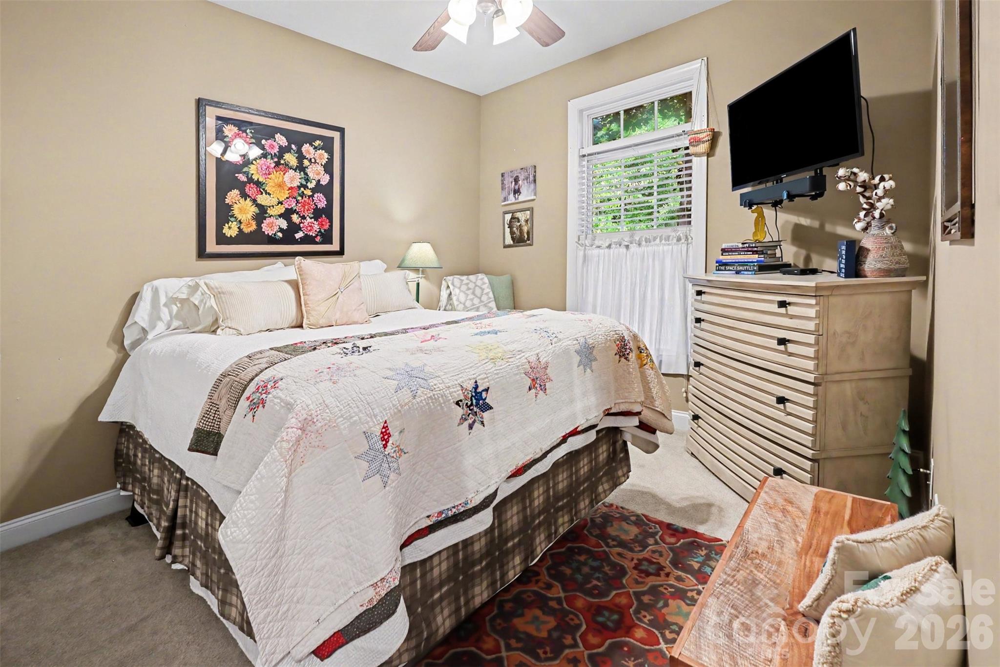 4037 Old Williamston Road Belton, SC 29627 - Photo 14 of 41 a bedroom with a bed and a flat screen tv