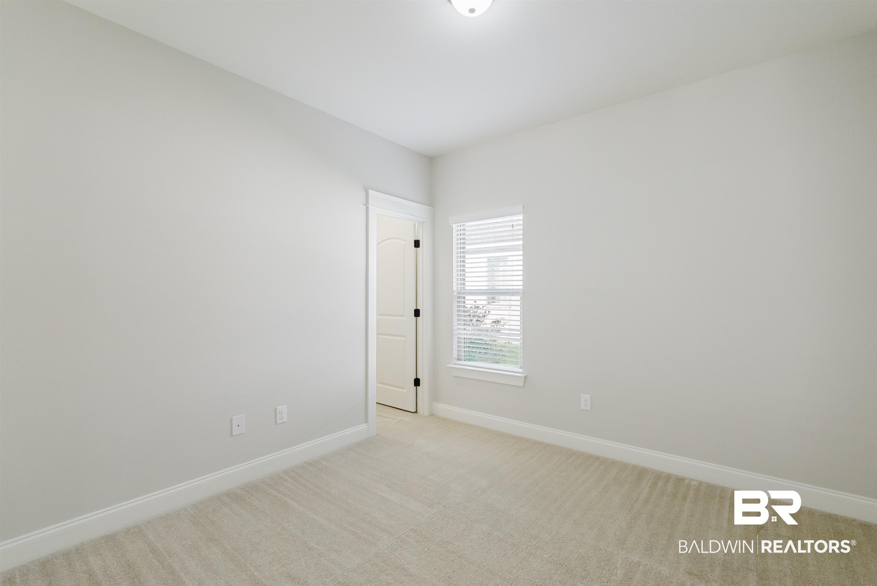 237 Hawthorne Circle Fairhope, AL 36532 - Photo 11 of 14 Unfurnished room with light colored carpet and baseboards