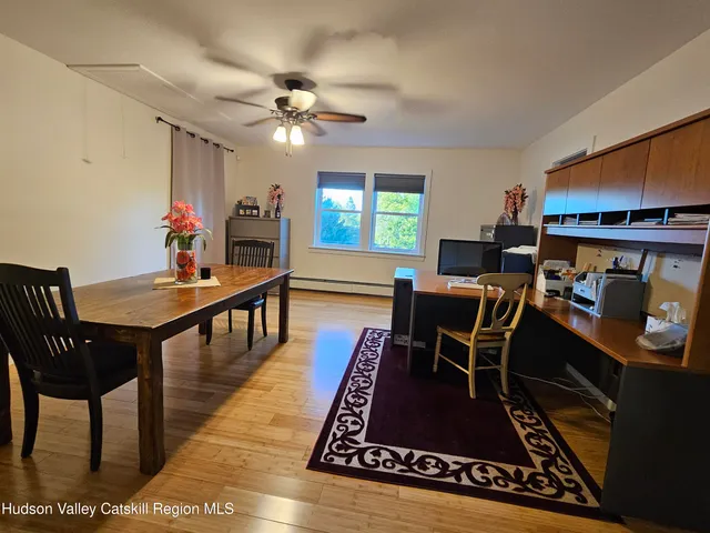 a living room with furniture fireplace and flat screen tv