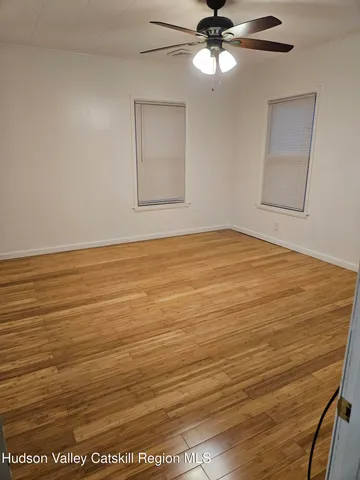 a view of a yard with a tree