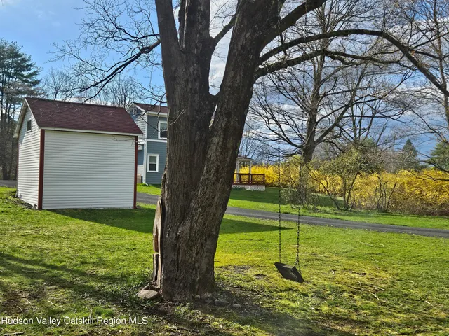 a view of an empty room with a fireplace