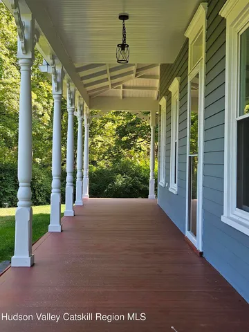 a view of a brick house with a yard