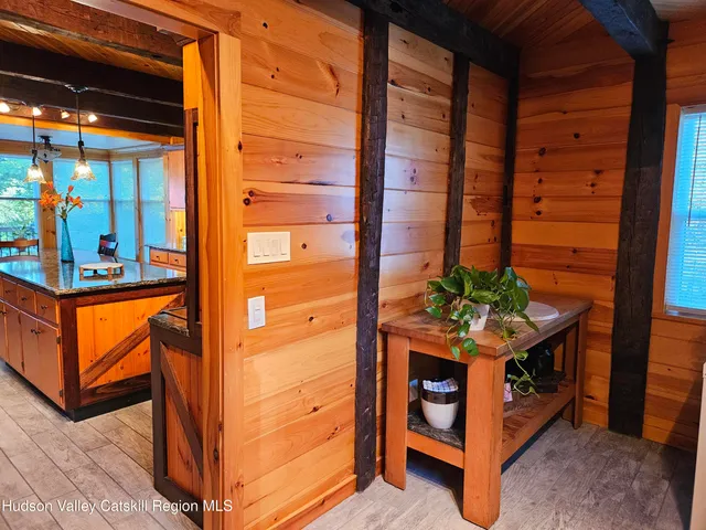 a kitchen with stainless steel appliances granite countertop a sink and wooden cabinets
