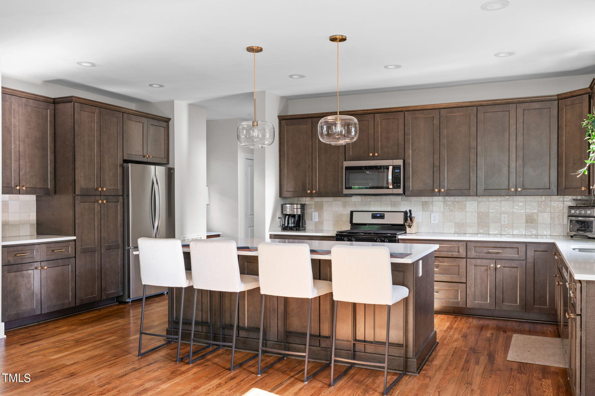 312 East Lee Street Raleigh, NC 27601 - Photo 14 of 48 a kitchen with stainless steel appliances granite countertop a refrigerator and microwave