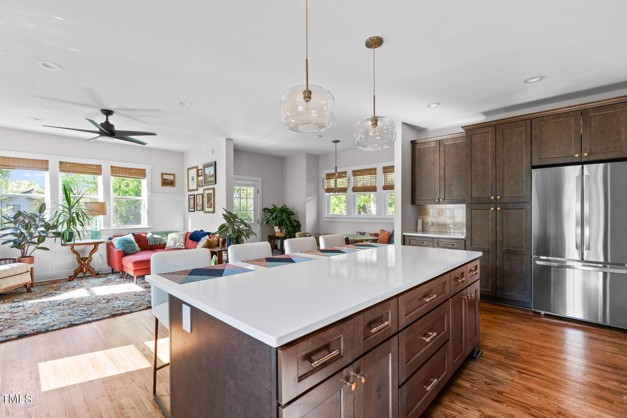 312 East Lee Street Raleigh, NC 27601 - Photo 17 of 48 a kitchen with a refrigerator a sink dishwasher a couches and chairs with wooden floor