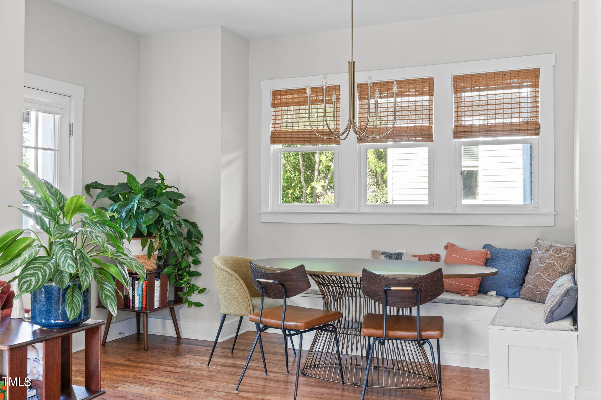312 East Lee Street Raleigh, NC 27601 - Photo 20 of 48 a dining room with furniture potted plants and wooden floor