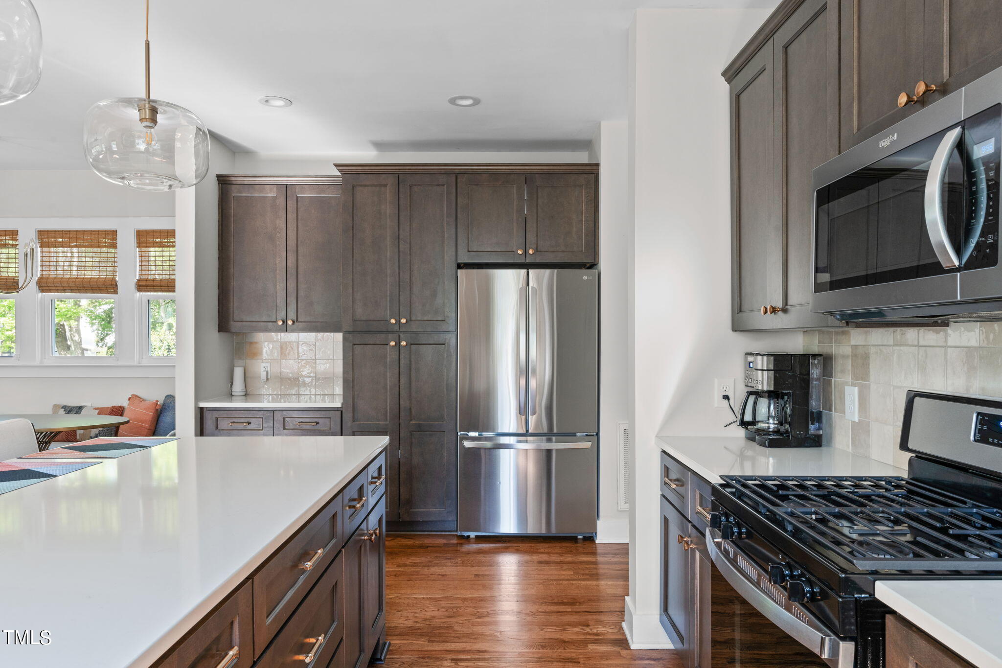 312 East Lee Street Raleigh, NC 27601 - Photo 25 of 48 a kitchen with granite countertop a stove sink and refrigerator