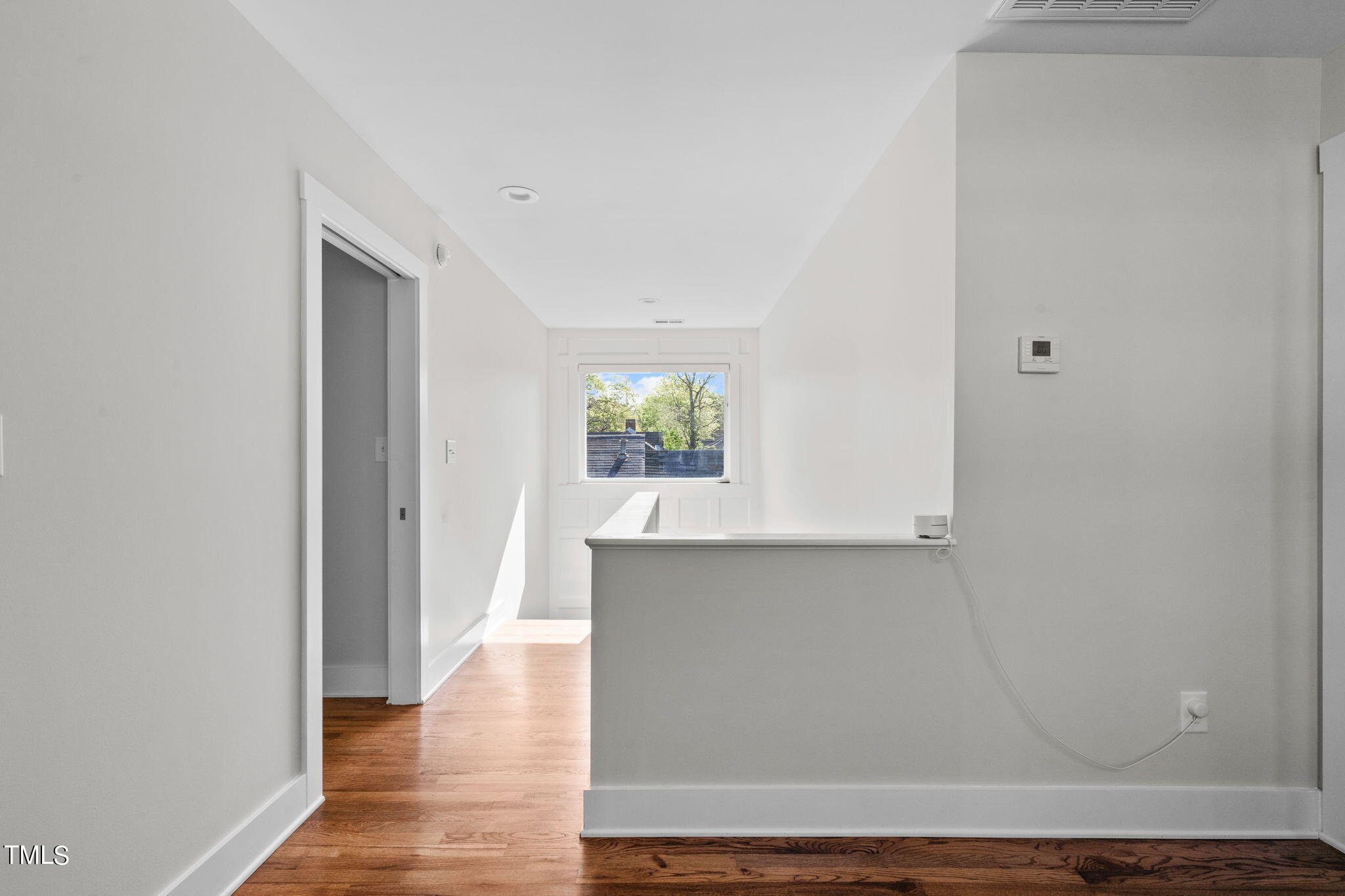 312 East Lee Street Raleigh, NC 27601 - Photo 26 of 48 a view of an empty room and wooden floor