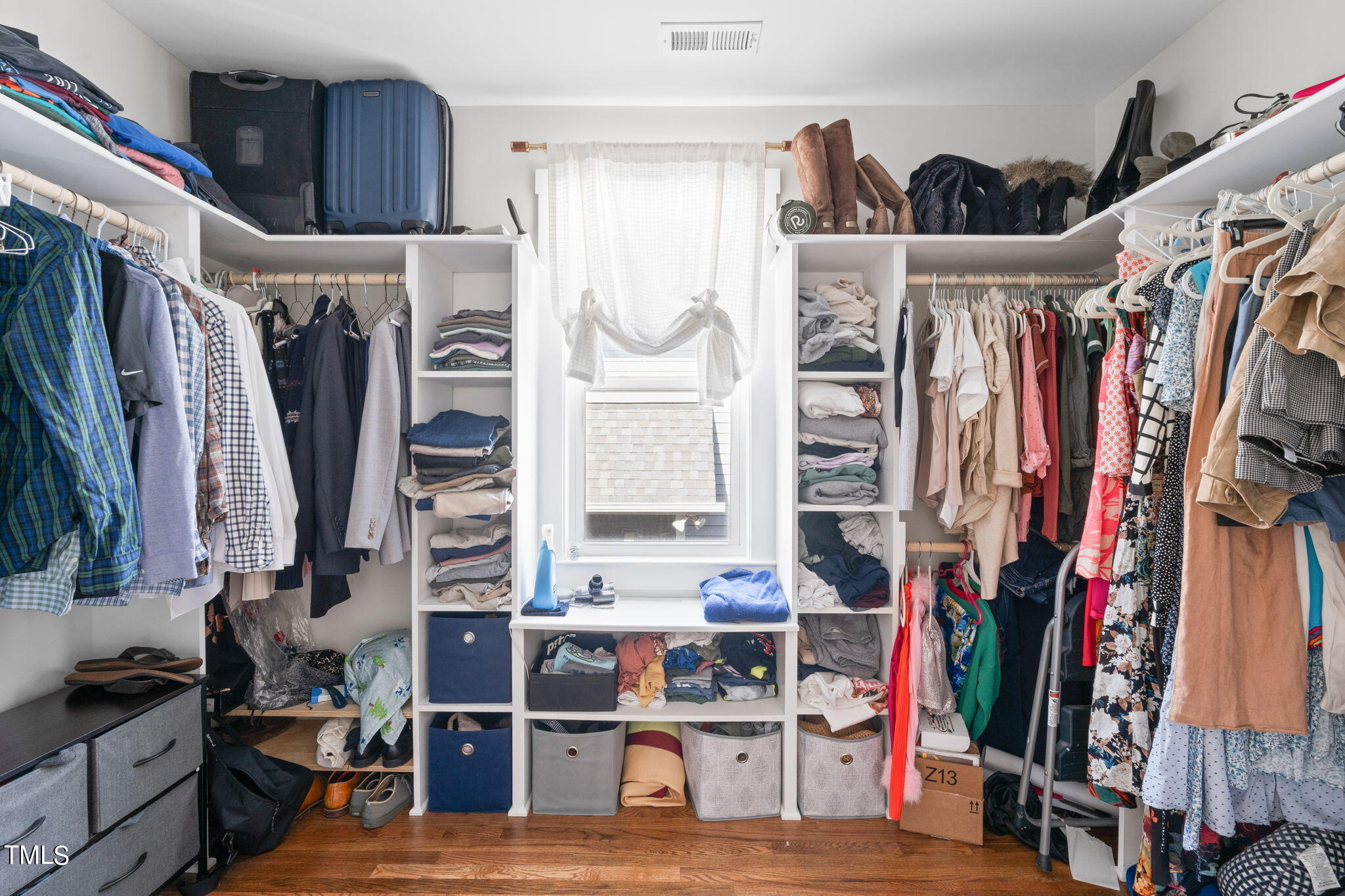 312 East Lee Street Raleigh, NC 27601 - Photo 36 of 48 a view of walk in closet with clothes and shoes