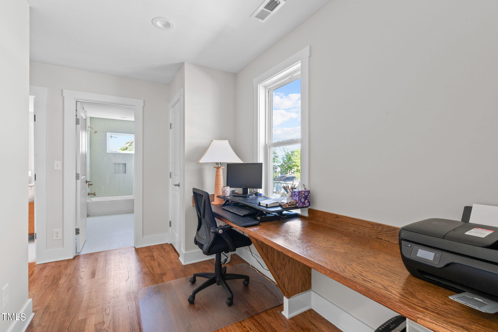 312 East Lee Street Raleigh, NC 27601 - Photo 37 of 48 a view of a workspace with furniture and a window