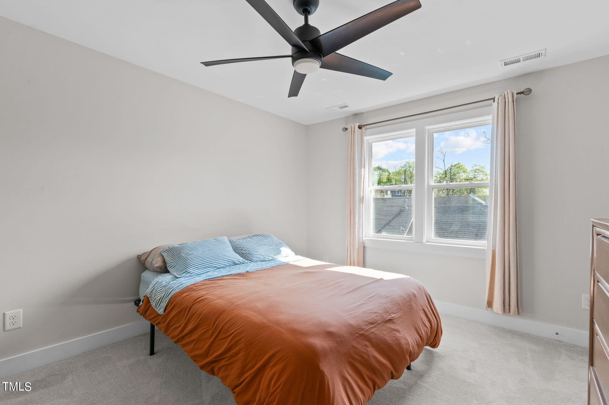 312 East Lee Street Raleigh, NC 27601 - Photo 39 of 48 a bedroom with a bed and window