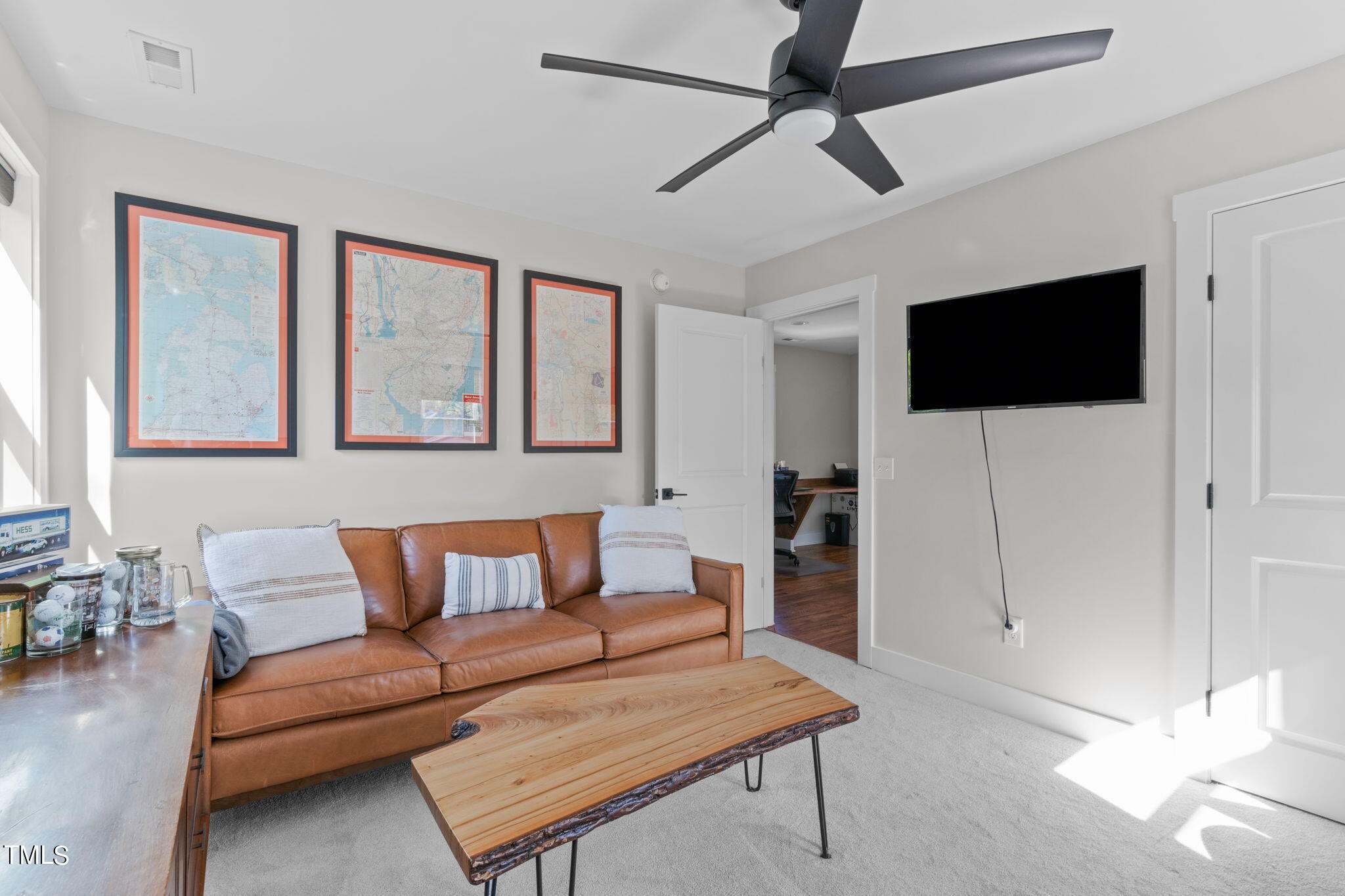 312 East Lee Street Raleigh, NC 27601 - Photo 42 of 48 a living room with furniture and a flat screen tv