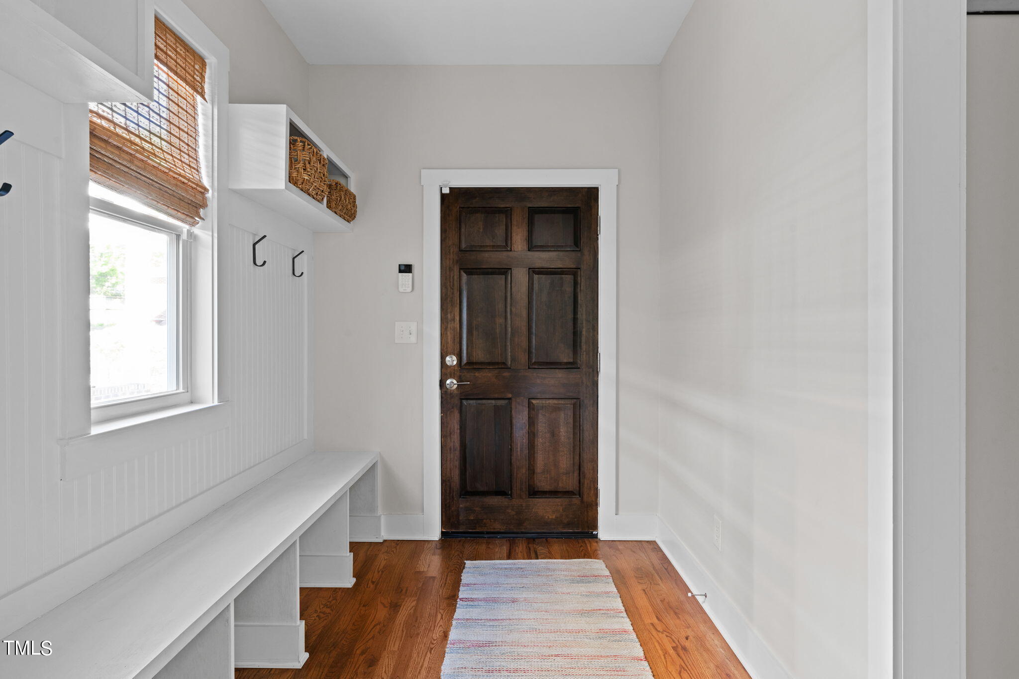 312 East Lee Street Raleigh, NC 27601 - Photo 6 of 48 a view of a hallway with wooden floor and a window