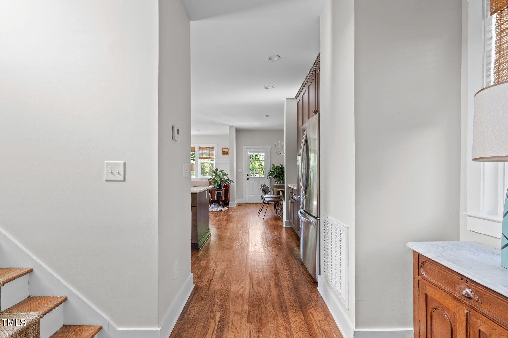 312 East Lee Street Raleigh, NC 27601 - Photo 10 of 48 a view of a hallway and wooden floor a livingroom with windows