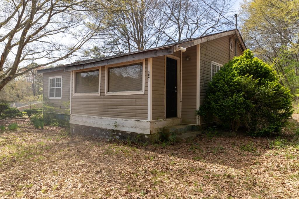 3091 Mason Creek Road Winston, GA 30187 - Photo 1 of 1 a view of a small house with a yard