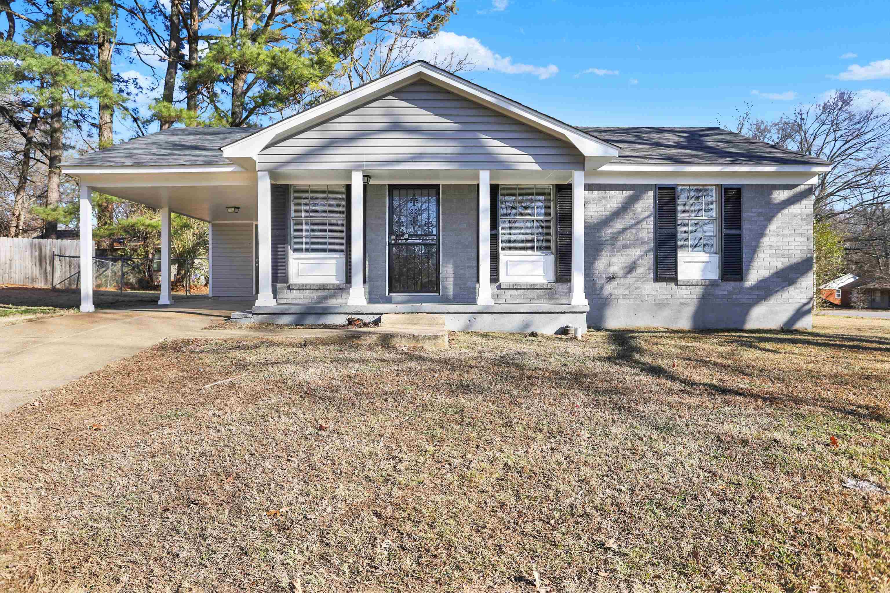 front view of a house with a yard