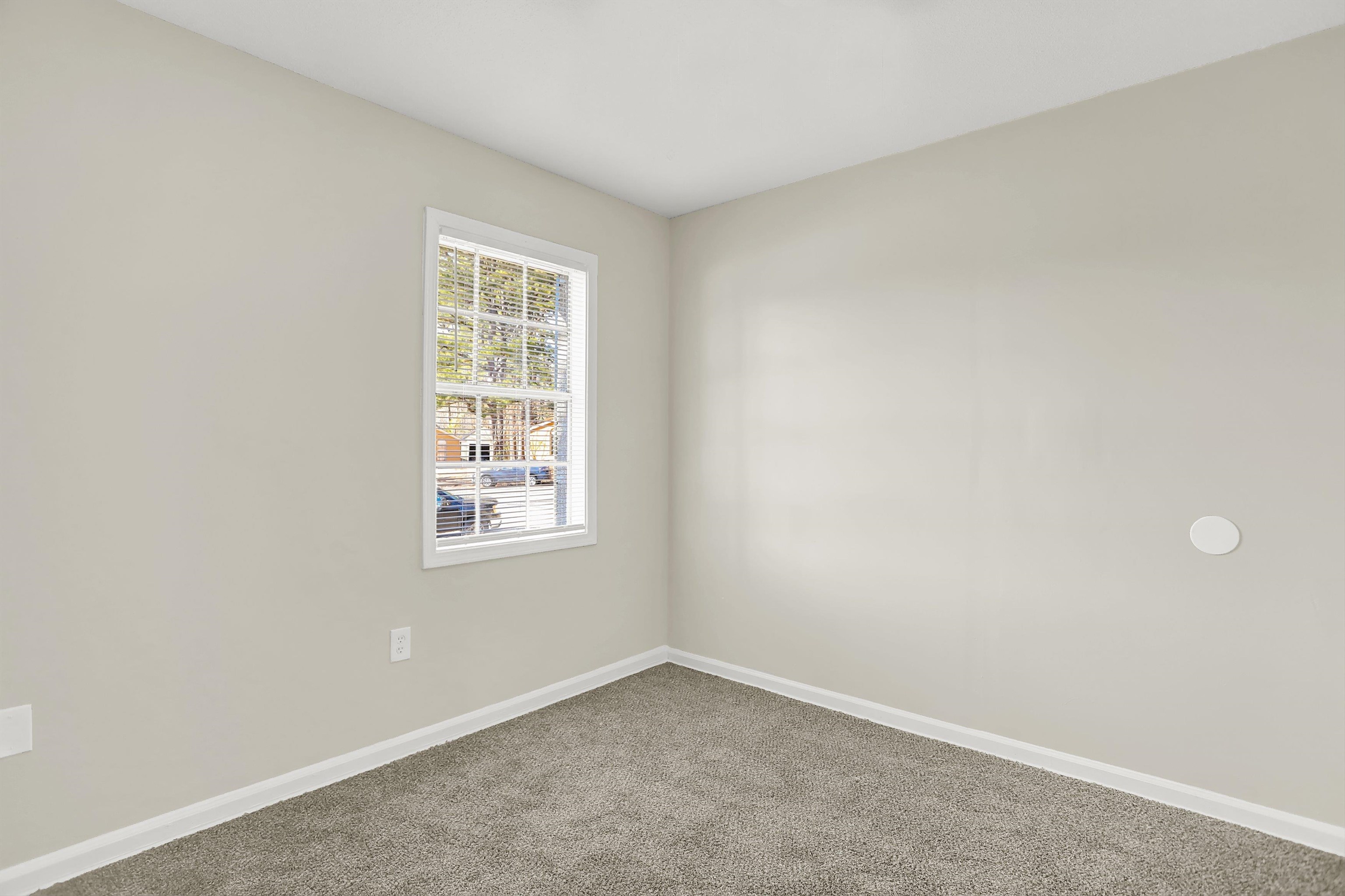 3716 Ridgemont Road Memphis, TN 38128 - Photo 22 of 30 an empty room with a window