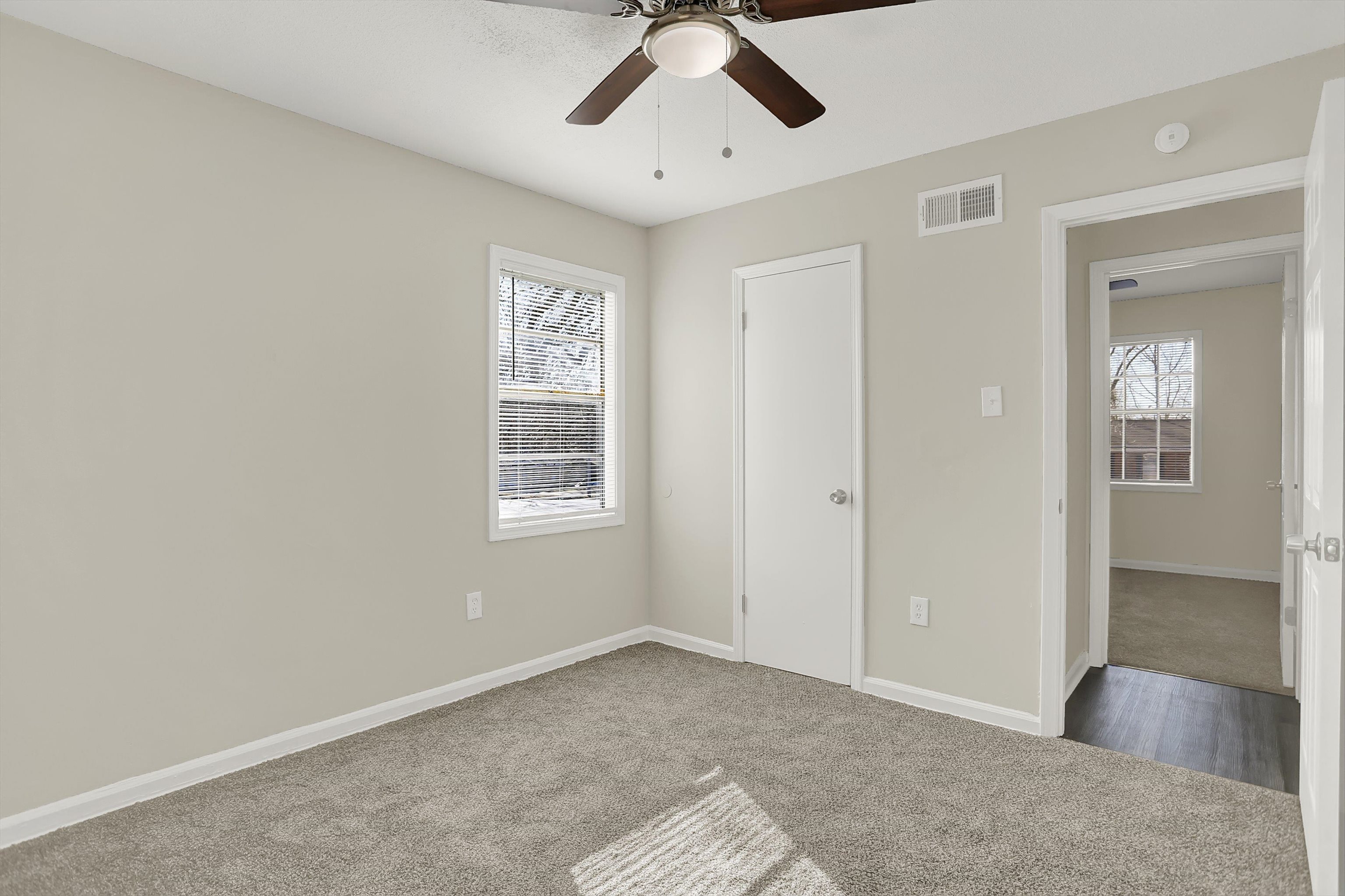 3716 Ridgemont Road Memphis, TN 38128 - Photo 25 of 30 a view of a big room with windows and chandelier fan