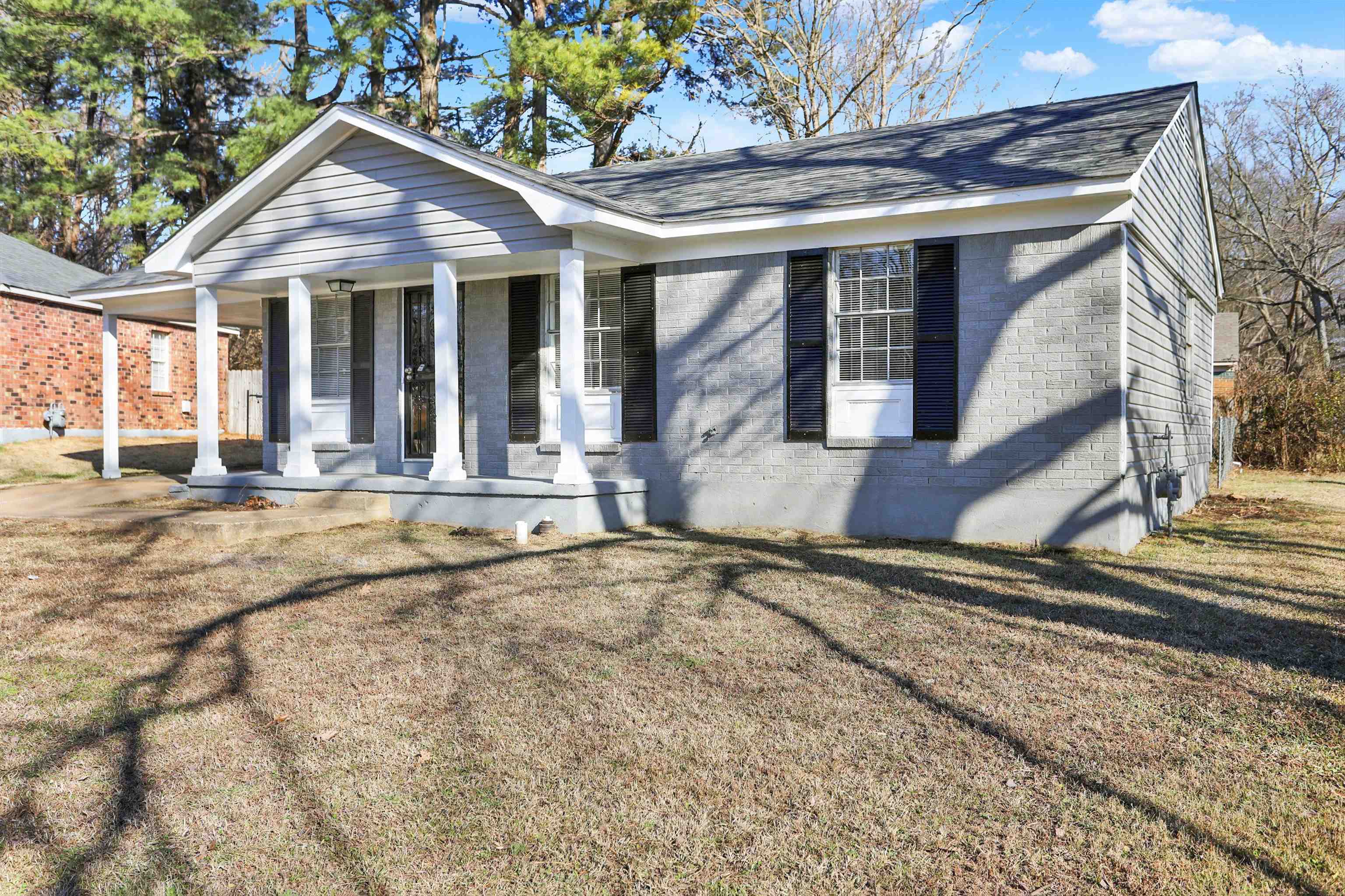 3716 Ridgemont Road Memphis, TN 38128 - Photo 3 of 30 a view of a house with a yard and wooden fence