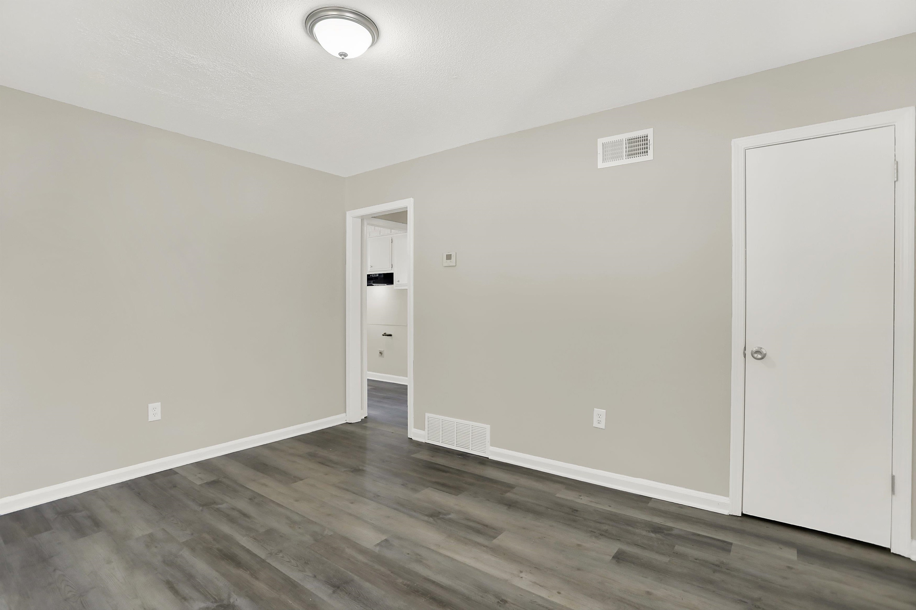3716 Ridgemont Road Memphis, TN 38128 - Photo 5 of 30 a view of an empty room with wooden floor