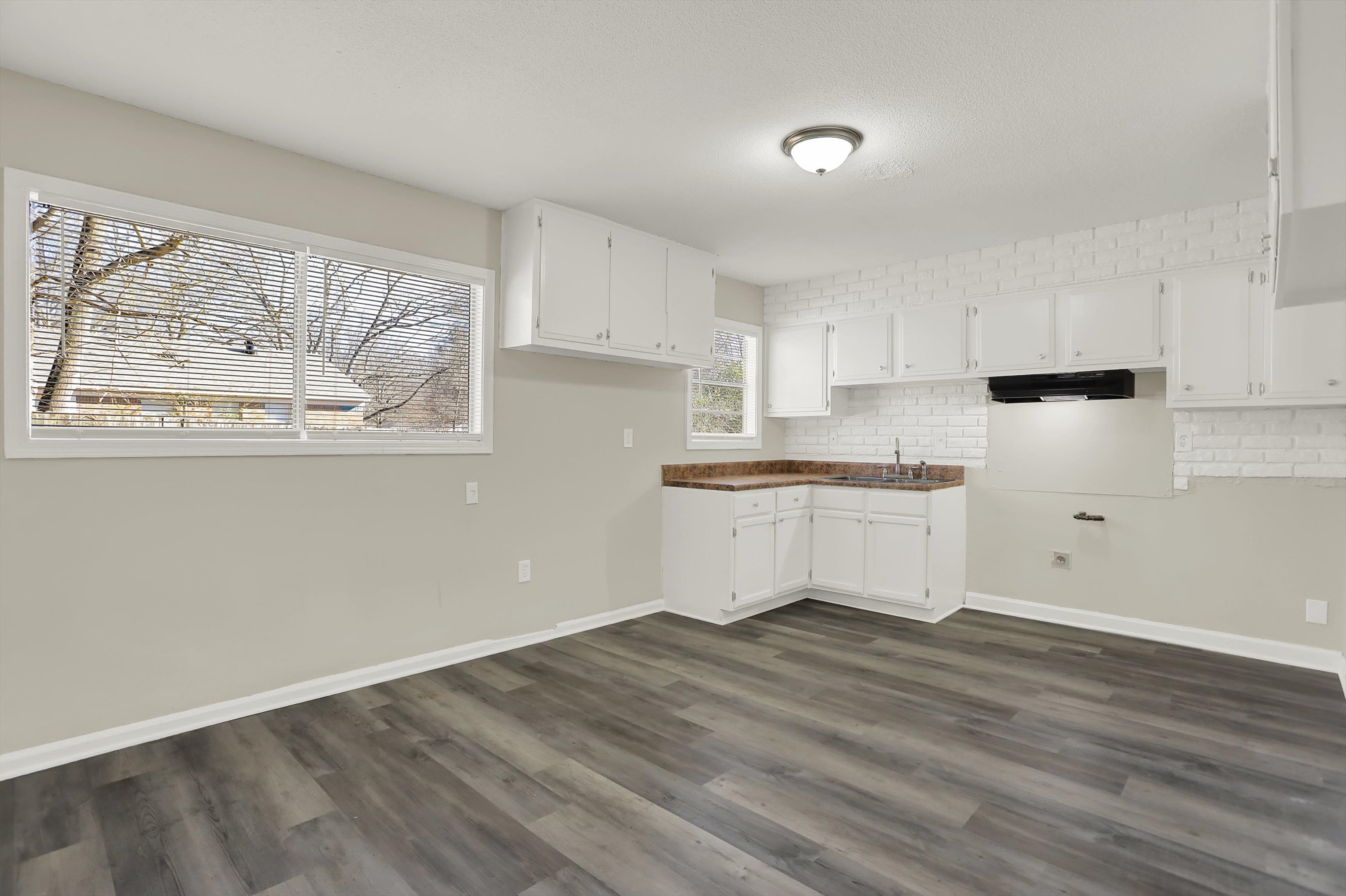 3716 Ridgemont Road Memphis, TN 38128 - Photo 8 of 30 a view of kitchen with wooden floor and electronic appliances
