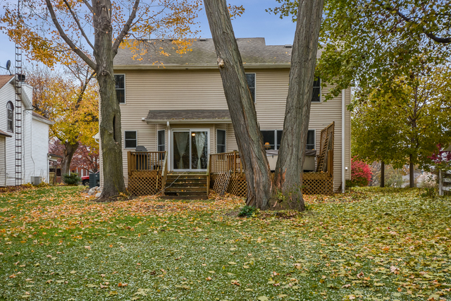 312 Main Street Oswego, IL 60543 - Photo 2 of 29 a view of a house with many windows and wooden fence