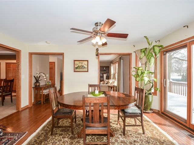 312 Main Street Oswego, IL 60543 - Photo 12 of 29 a view of a dining room with furniture window and wooden floor