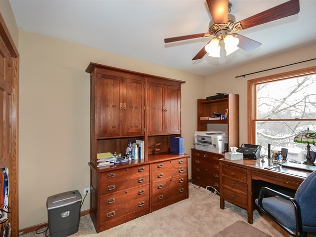 312 Main Street Oswego, IL 60543 - Photo 20 of 29 a room with a bed and a dresser