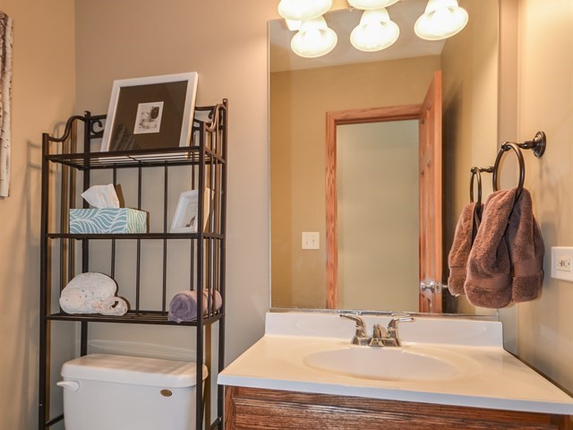 312 Main Street Oswego, IL 60543 - Photo 24 of 29 a bathroom with a sink and a mirror