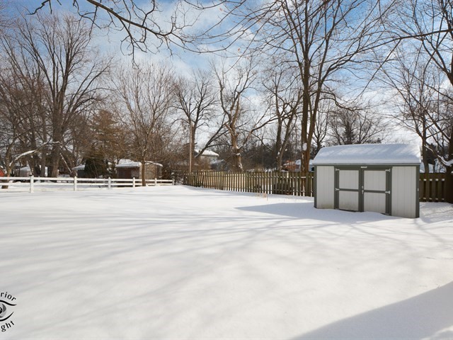 312 Main Street Oswego, IL 60543 - Photo 28 of 29 a house with trees in front of it