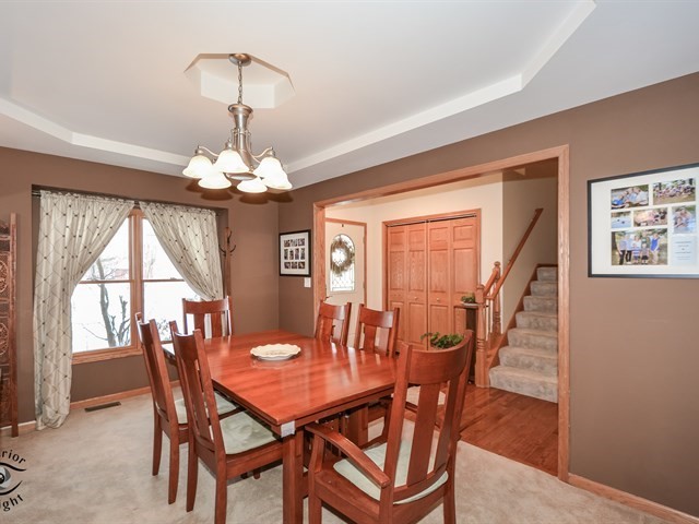 312 Main Street Oswego, IL 60543 - Photo 8 of 29 a view of a dining room with furniture window and wooden floor