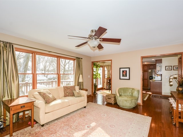 312 Main Street Oswego, IL 60543 - Photo 10 of 29 a living room with furniture and a large window