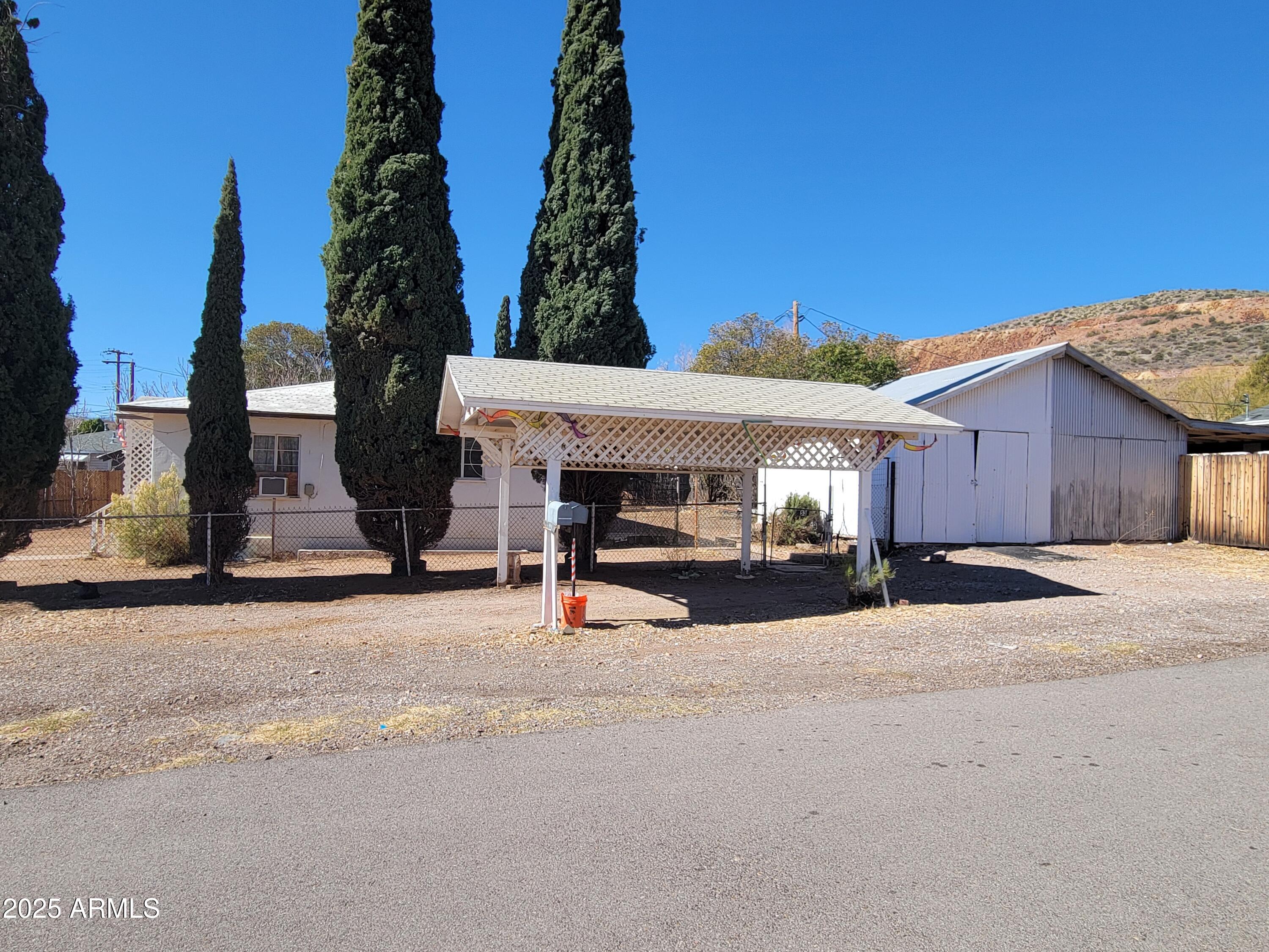 53 Spray Avenue Bisbee, AZ 85603 - Photo 16 of 21 a view of a house with backyard and garage